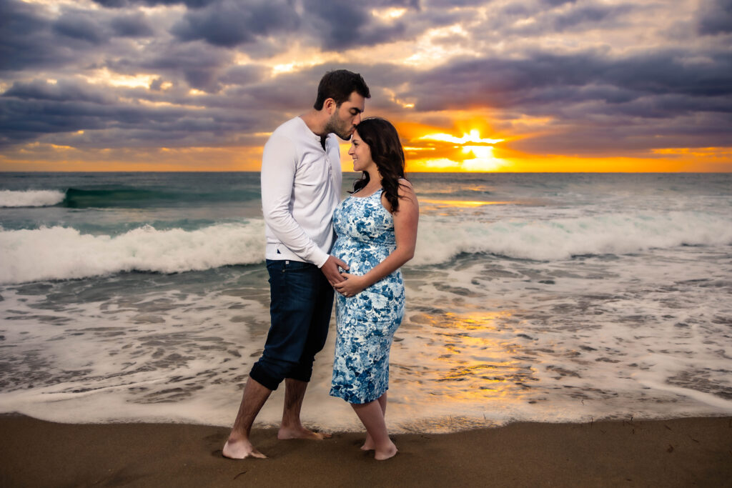 Playful beach engagement session at Deerfield Beach in South Florida.