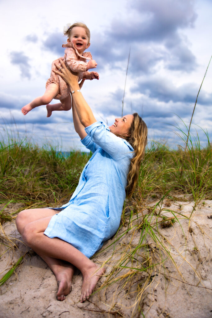 Parents playing with kids during family session in South Florida